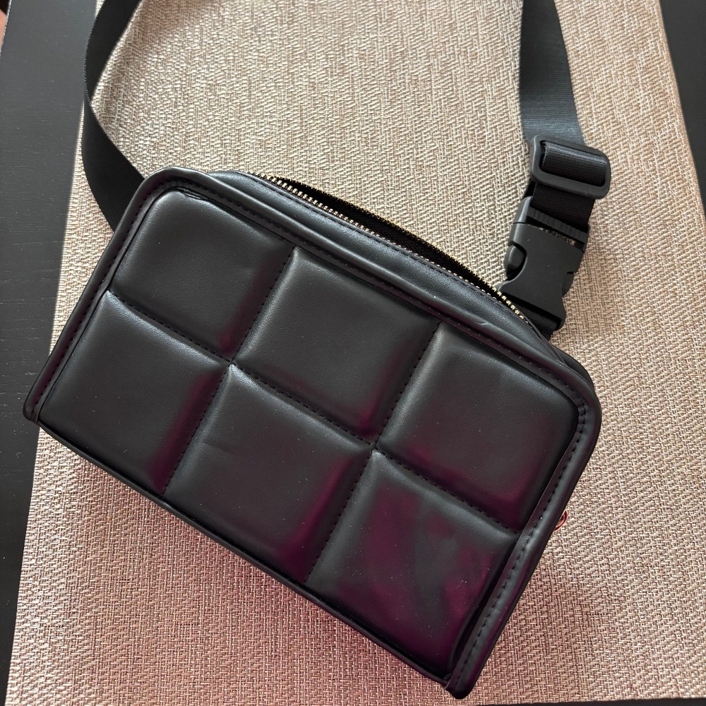 Amanda Uprichard black belt bag. Can be worn across the body or on waist.